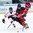ZUG, SWITZERLAND - APRIL 26: Canada's Glenn Gawdin #15 controls the puck past Switzerland's Kristian Suleski #12 during bronze medal game action at the 2015 IIHF Ice Hockey U18 World Championship. (Photo by Francois Laplante/HHOF-IIHF Images)